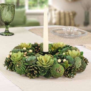 A green wreath used as a table centerpiece