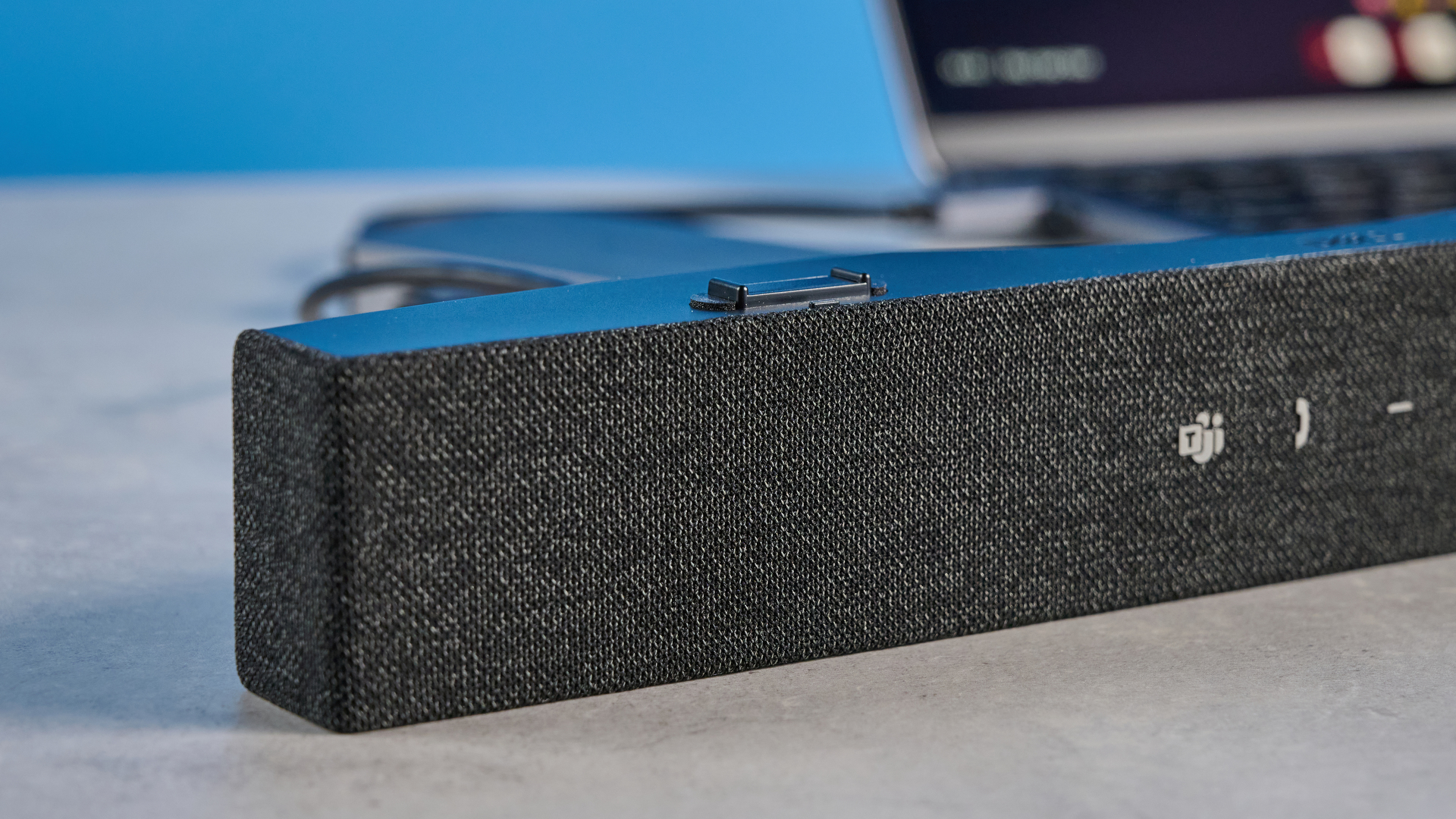 Dell SB725 computing conference soundbar photographed on a blue background