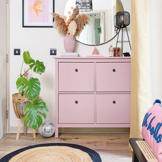 Hallway with pink shoe storage