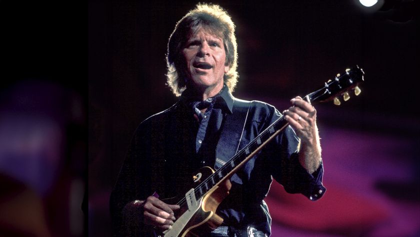 American Rock musician John Fogerty plays guitar as he performs onstage during the Farm Aid benefit concert at the World Music Theater, Tinley Park, Illinois, October 8, 1997. 