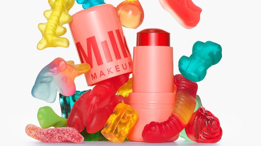 Milk Jelly Tint products on a plain backdrop with gummy and jello food