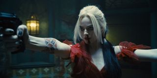 Harley Quinn (Margot Robbie) aims her guns in The Suicide Squad (2021)