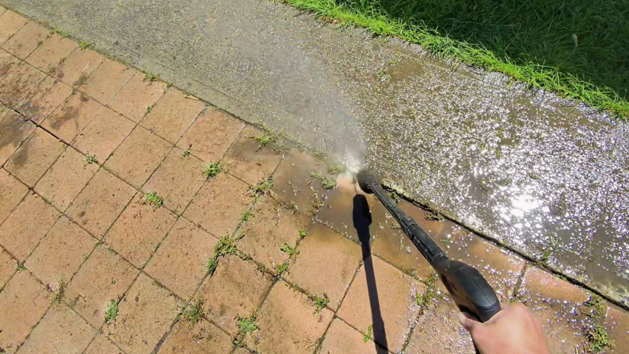 Stihl REA 100 Plus removing weeds from pavers.