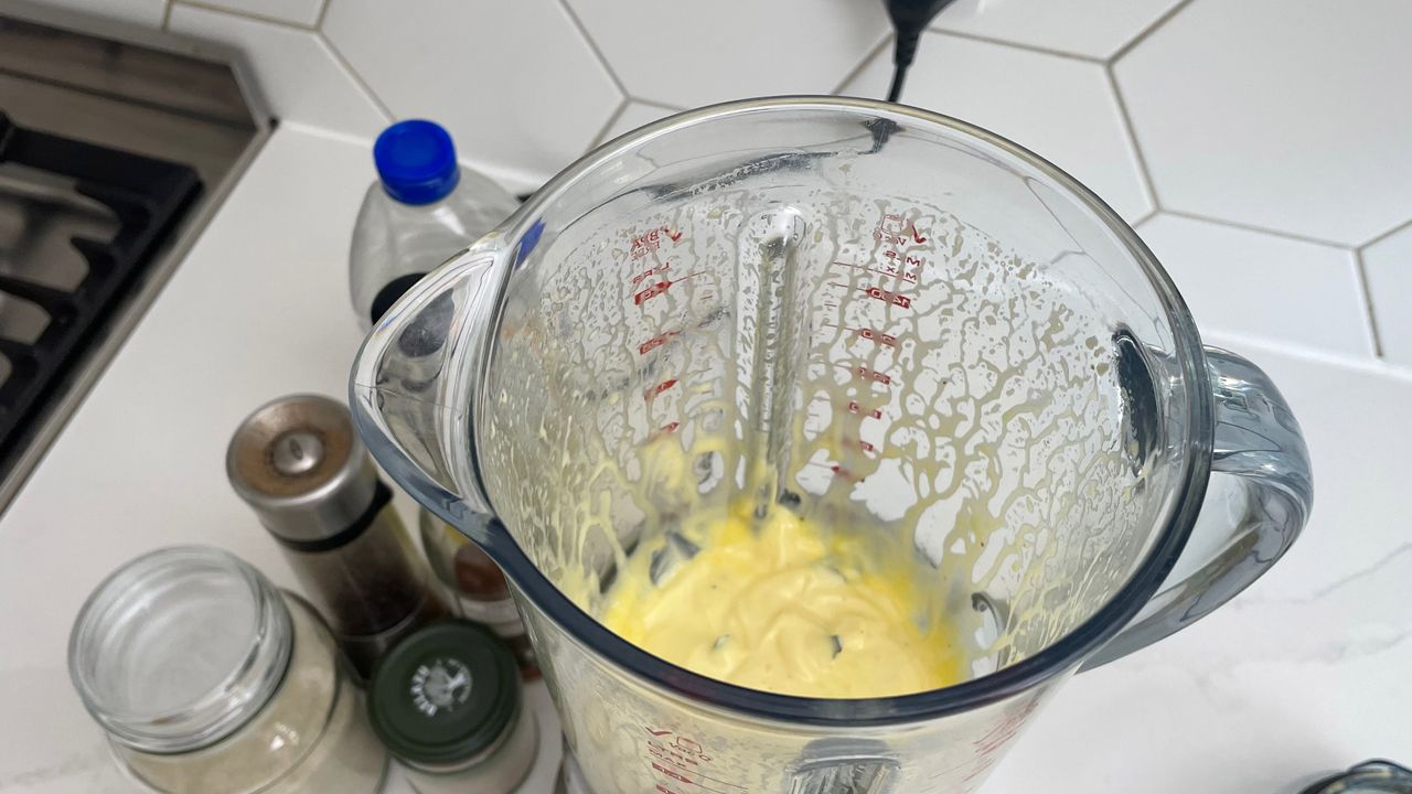 The Breville the Fresh &amp; Furious on a kitcehn countertop with freshly made mayonniase in the pitcher