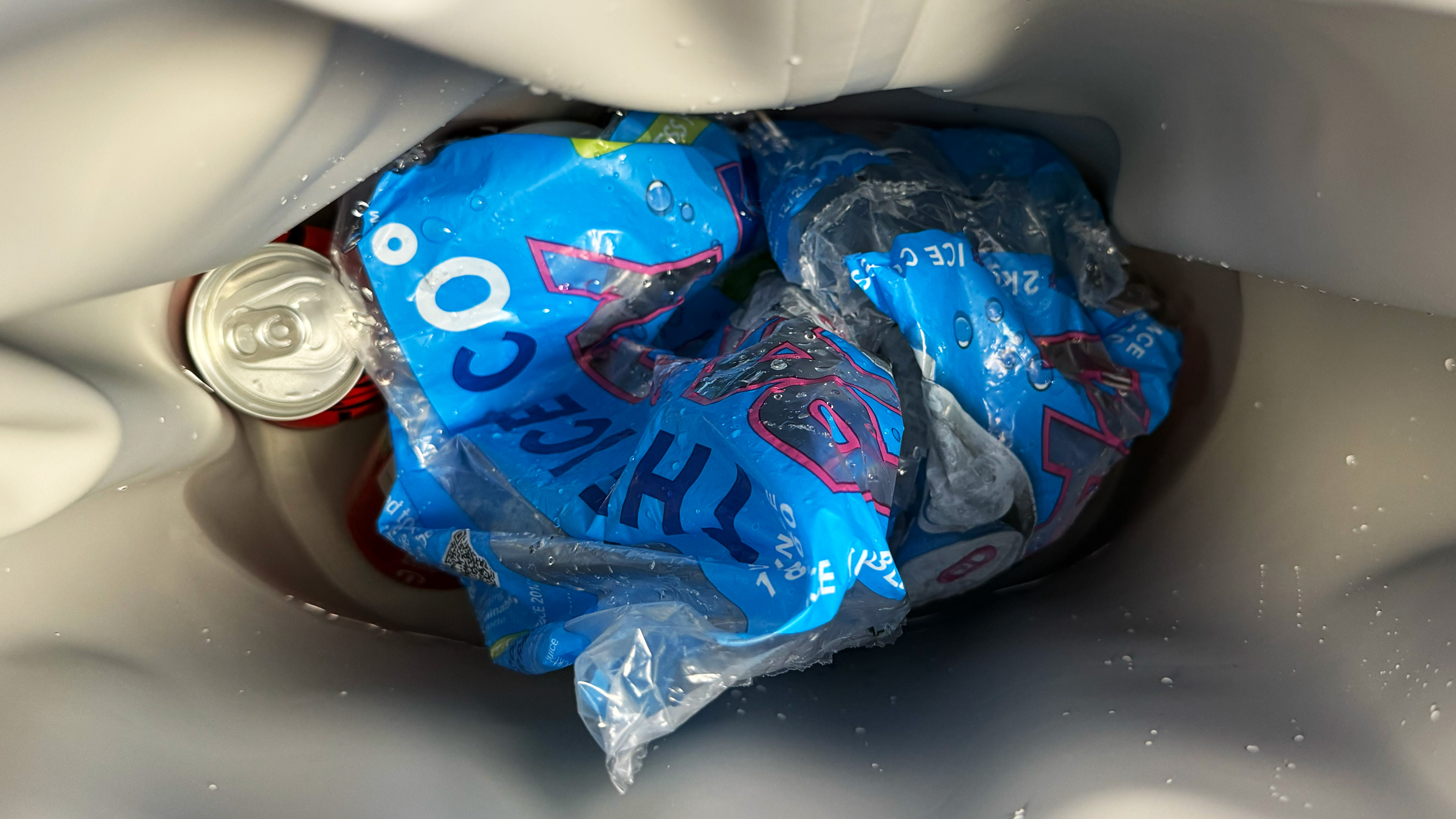 a photograph of the yeti hopper m15 with cans of coke and ice inside