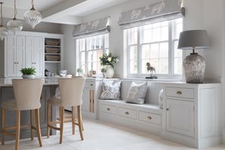 Characterful spacious kitchen diner with Georgian bespoke carpentry in bright blue, storage and a kitchen island