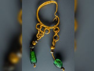 A gold earring found at the underwater site.