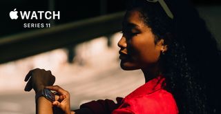 Marketing image for the Apple Watch Series 11 - a woman in a red top is checking her Watch