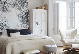Bedroom with black and white branch wall mural