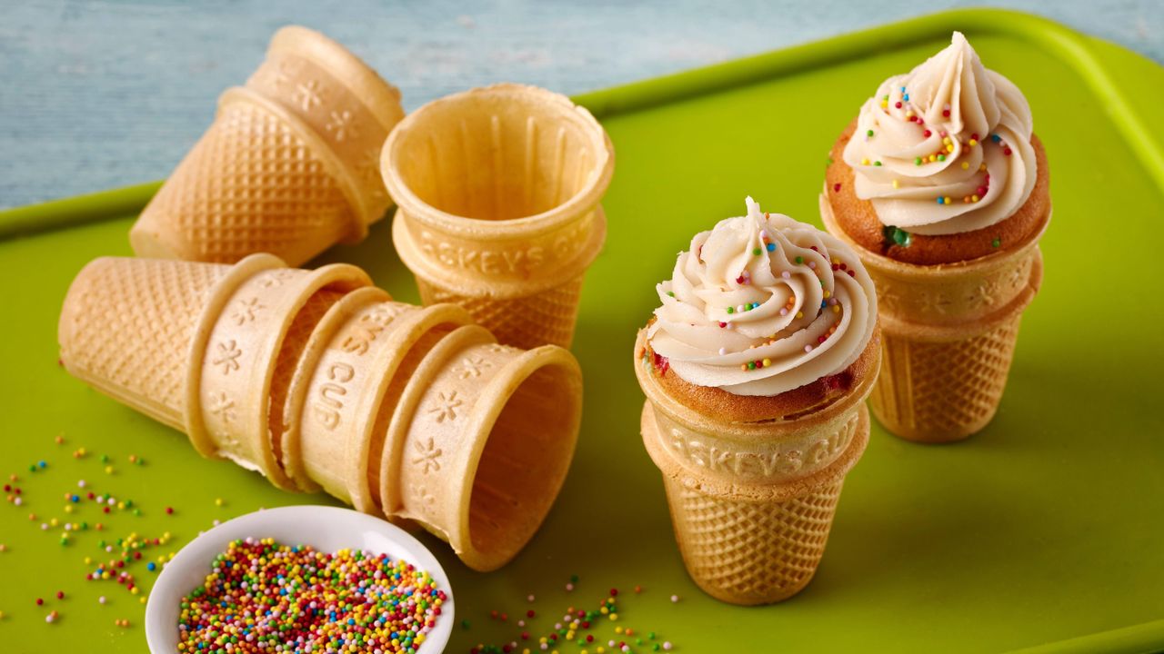 ice cream cupcakes decorated with icing and sprinkles