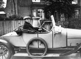 Vivian Woodward, who played football for Tottenham, Chelsea and England, sets off to deliver churns of milk to market in October 1925.