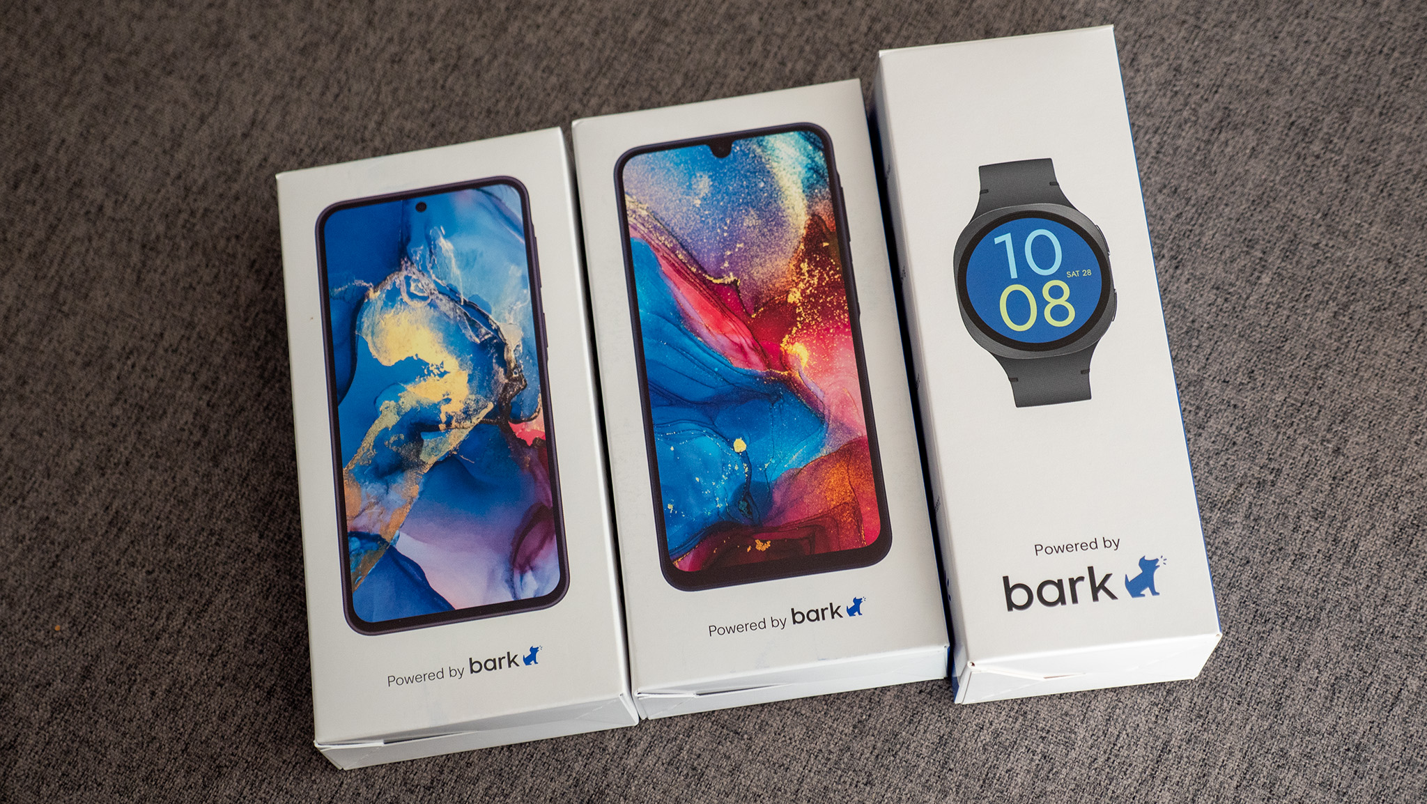 The boxes for both 2026 Bark Phones and the 2026 Bark Watch