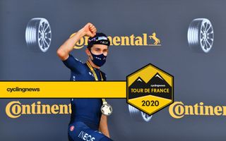 Ineos Grenadiers’ Michal Kwiatkowski celebrates having won stage 18 of the Tour de France