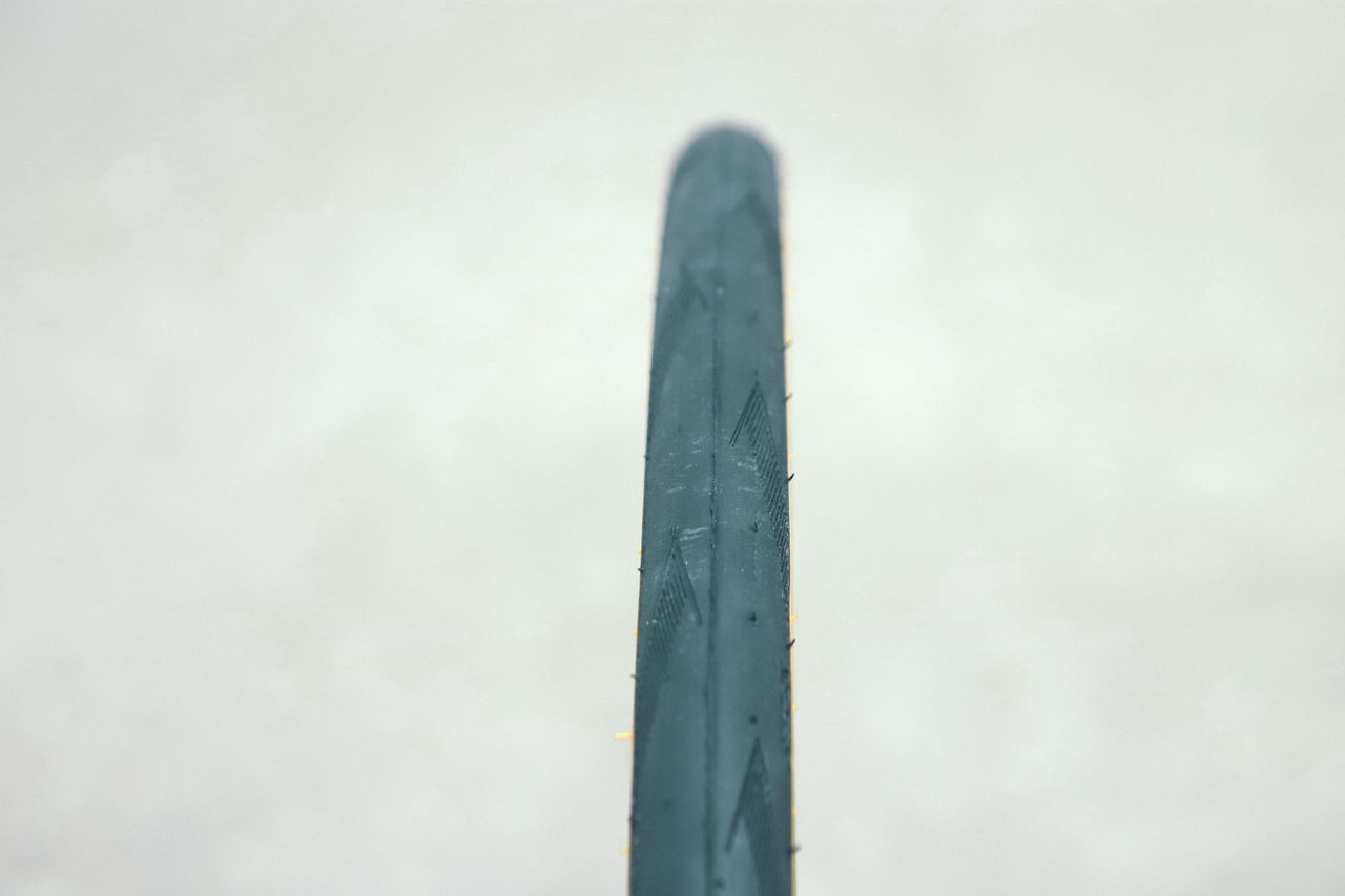 A tan bicycle tyre on a white background