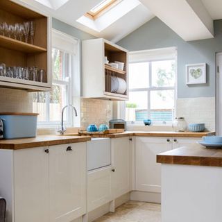 kitchen with cabinets and wooden storage shelves
