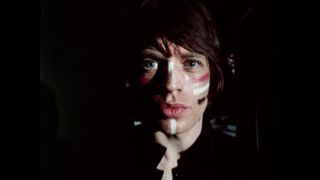 The Rolling Stones' "Jumpin' Jack Flash" music video - a still of Mick Jagger