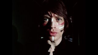 The Rolling Stones&#039; &quot;Jumpin&#039; Jack Flash&quot; music video - a still of Mick Jagger