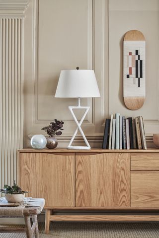 Books on a sideboard in a neutral living room