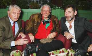A photo of three males sat next to each other, including Sir Don McCullin.