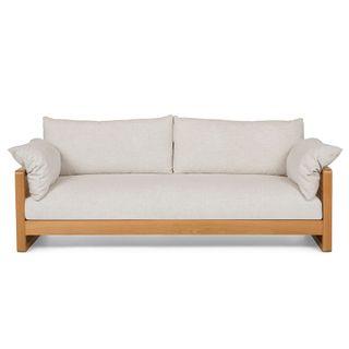 A wood framed white sofa
