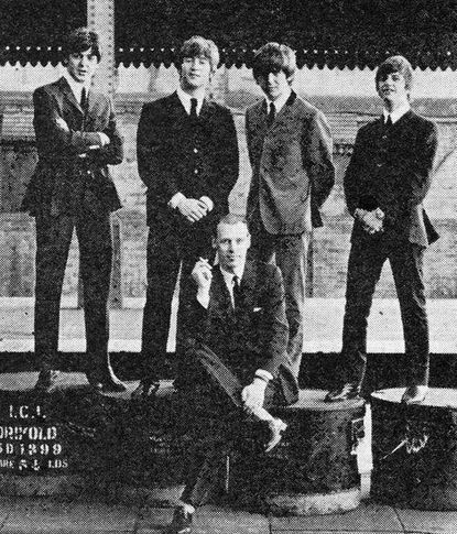 George Martin and the Beatles.