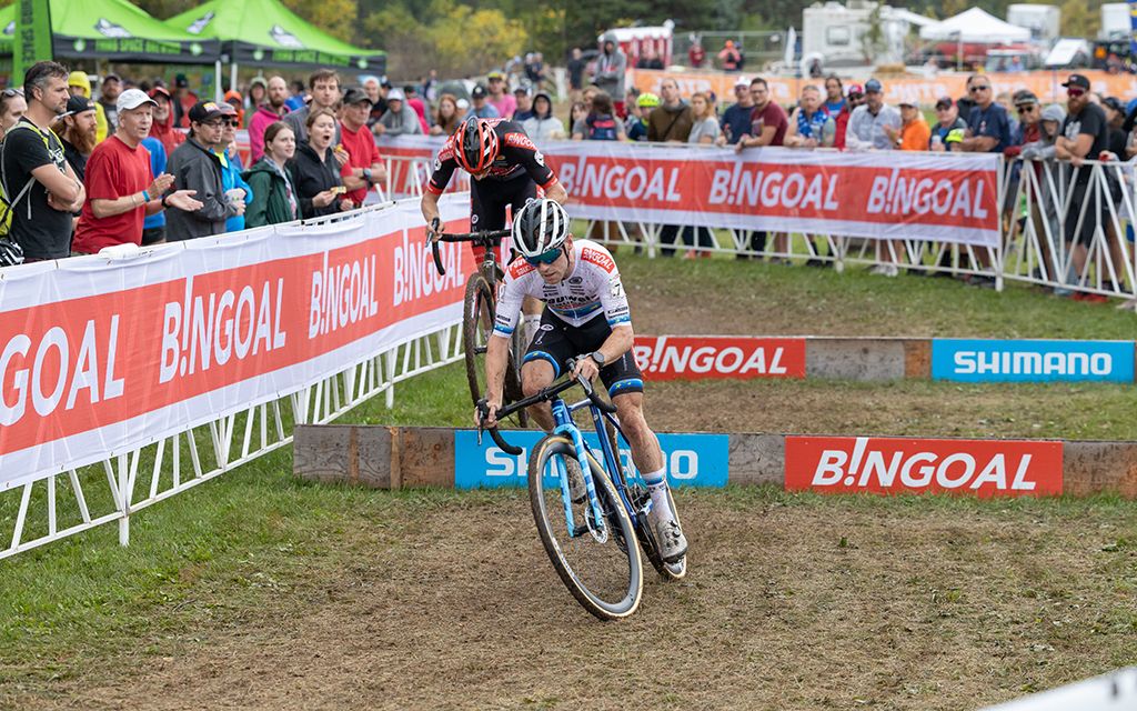 Eli Iserbyt and Michael Vanthourenhout go over the barriers at the Waterloo UCI Cyclo-cross World Cup men's elite race 2021