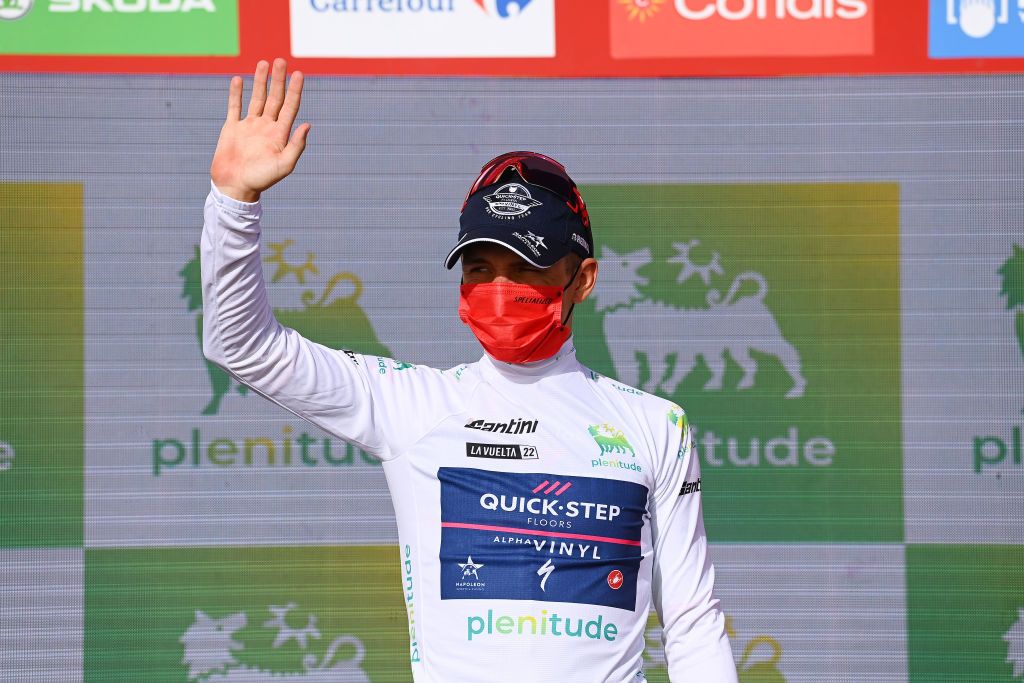 CABO DE GATA SPAIN AUGUST 31 Remco Evenepoel of Belgium and Team QuickStep Alpha Vinyl celebrates winning the White Best Young Jerseyon the podium ceremony after the 77th Tour of Spain 2022 Stage 11 a 1912km stage from ElPozo Alimentacin Alhama de Murcia to Cabo de Gata LaVuelta22 WorldTour on August 31 2022 in Cabo de Gata Spain Photo by Tim de WaeleGetty Images