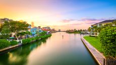 Naples, Florida, USA downtown cityscape on the bay at dusk.