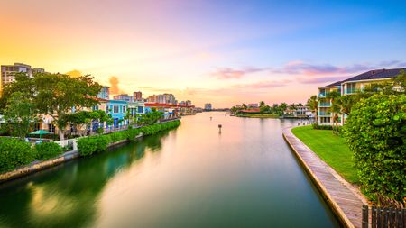 Naples, Florida, USA downtown cityscape on the bay at dusk.