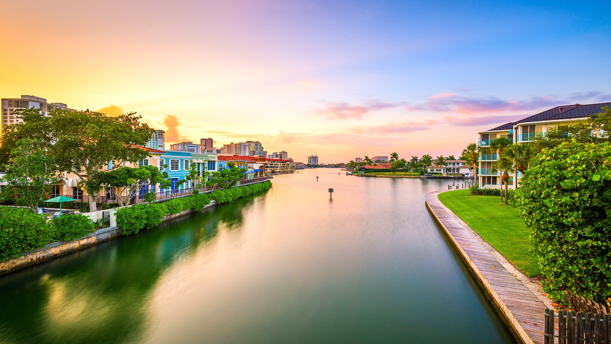 Naples, Florida, USA downtown cityscape on the bay at dusk.