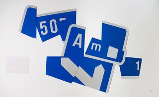exhibit of a road sign in pieces