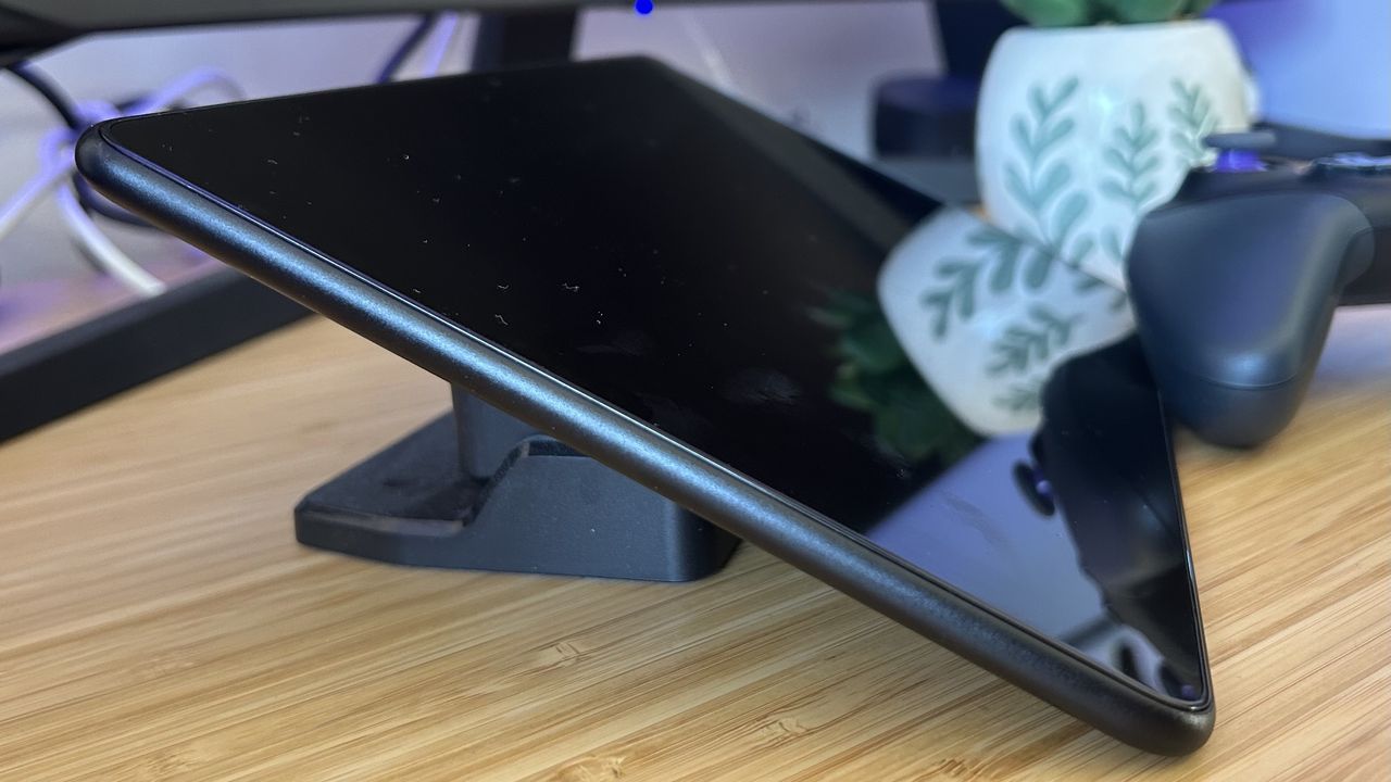 Side of Amazon Fire HD 10 on a wooden table