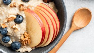 Apple on porridge in a bowl