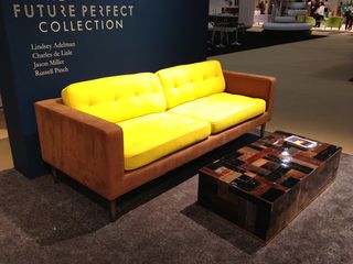 Bright yellow sofa & wooden coffee table