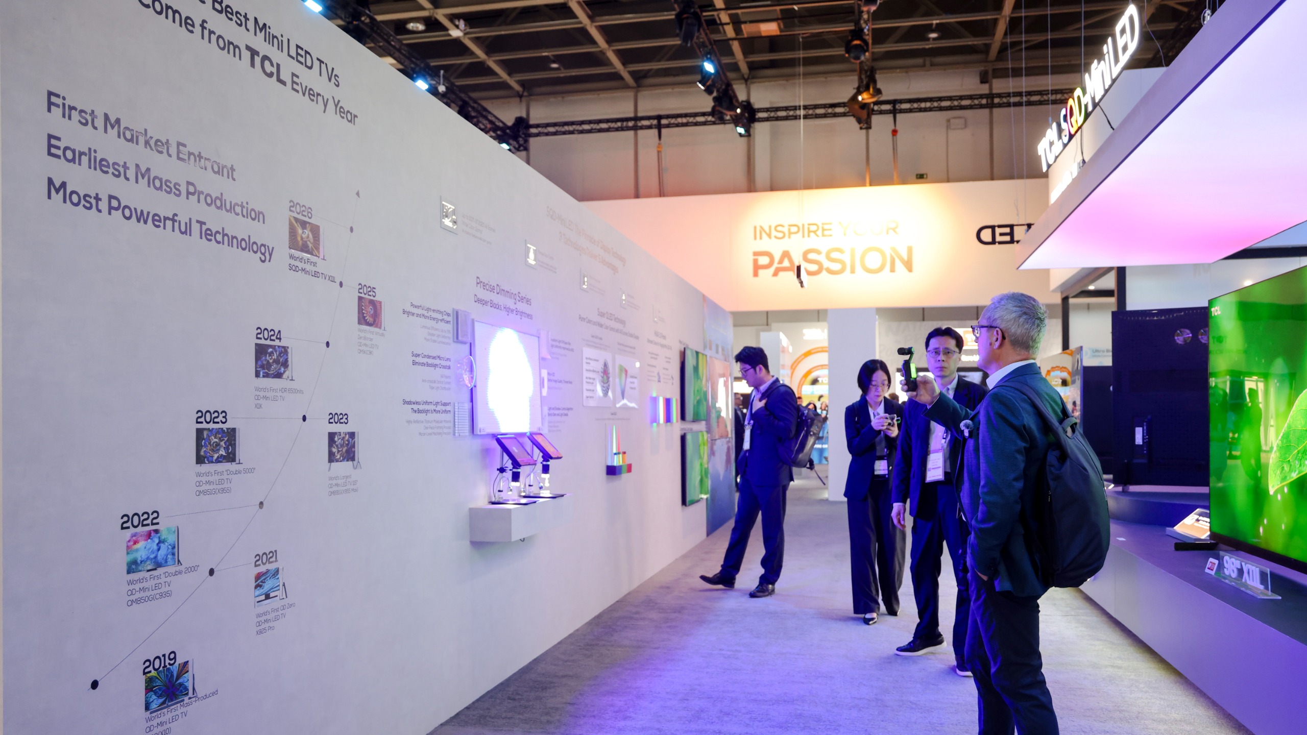 TCL's booth at IFA 2026, showing people looking at a timeline of TCL's TV developlemt