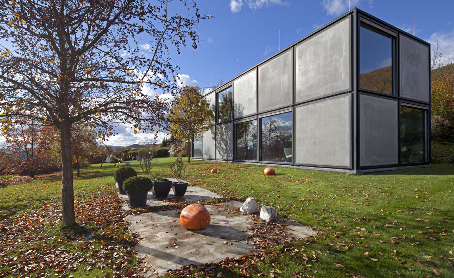 Clad in concrete and glass panels