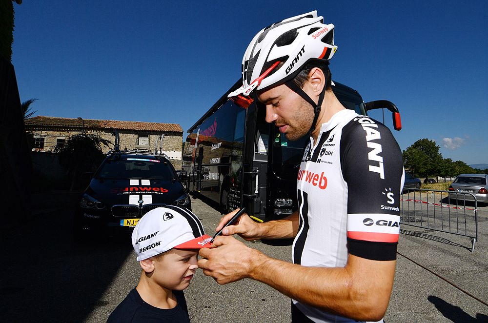 Tom Dumoulin (Sunweb) signs a fan's hat before heading out on a training ride