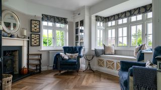 A living room with traditional glazing and cosy interiors