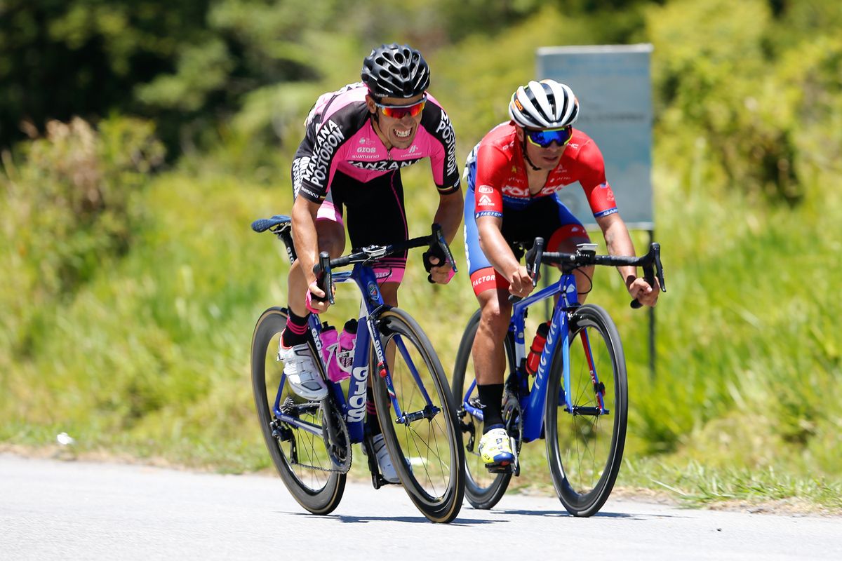 Bernardo Albeiro Suaza Arango (Manzana Postobon) sprinting for the KOM points