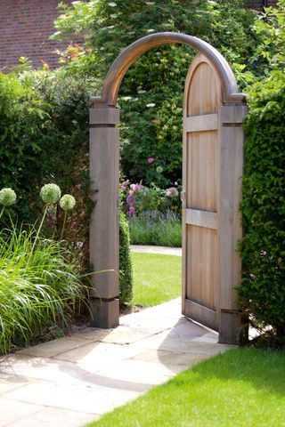 wooden oak gate set in a hedge