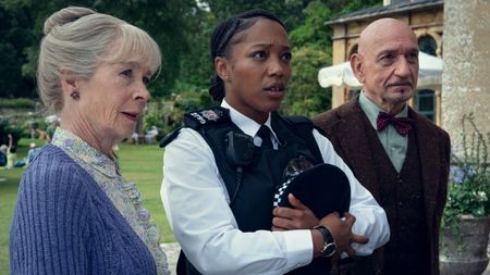 Celia Imrie as Joyce Meadowcroft, Naomi Ackie as PC Donna De Freitas, and Sir Ben Kingsley as Ibrahim Arif in The Thursday Murder Club.