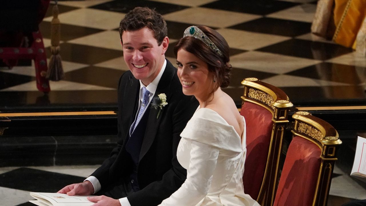  Jack Brooksbank and Princess Eugenie of York during their wedding ceremony at St. George&#039;s Chapel on October 12, 2018 in Windsor, England