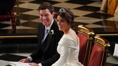  Jack Brooksbank and Princess Eugenie of York during their wedding ceremony at St. George's Chapel on October 12, 2018 in Windsor, England