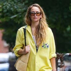 Jennifer Lawrence wearing a yellow shirt