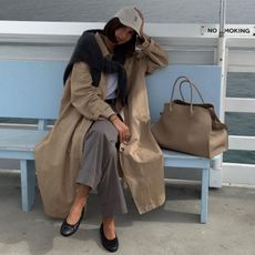 @lisonseb in trench coat with elevated tote bag