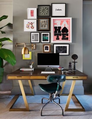 Home office with desk and artworks on the wall