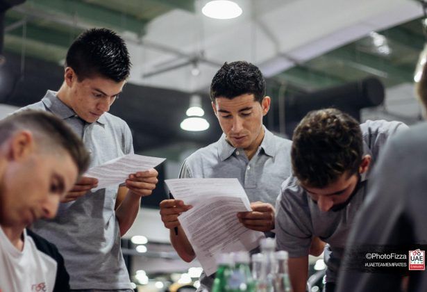 Riders study some paperwork
