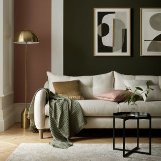 Neutral sofa with green throw and cushions