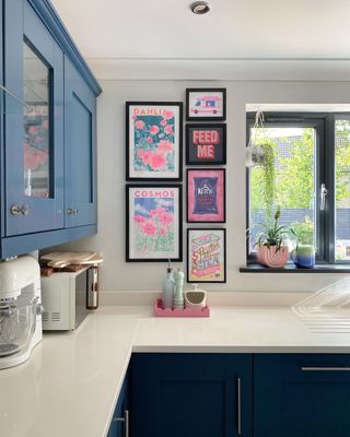 A kitchen corner with a wall with wall art