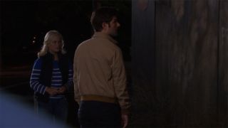 Leslie Knope (Amy Poehler) and Ben Wyatt (Adam Scott) at a gas station in Parks and Recreation